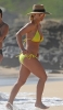 60781940_britney-spears-on-beach-in-a-yellow-bikini-in-hawaii-03-01-2018-048.jpg